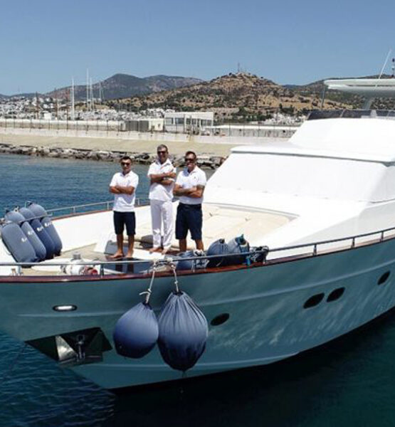 A view of the crewed Rose 25 motor yacht anchored in the harbor of Bodrum
